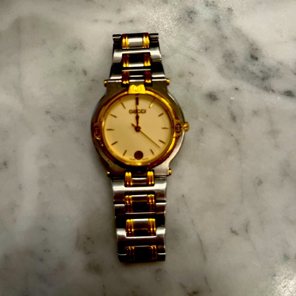 This Gucci watch is beautiful. Sized for a woman’s wrist.